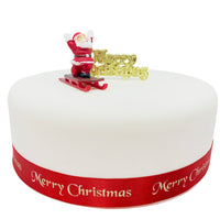 Father Christmas on Sleigh Plastic Cake Topper & Gold Merry Christmas Motto